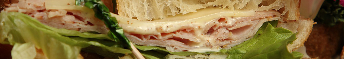 Eating Sandwich at Subs-N-Such restaurant in Manhattan, KS.